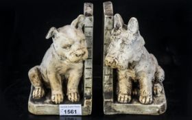 Pair of Plaster Dog Ends depicting a Scottie Dog and a Staffordshire Terrier, circa 1930s,