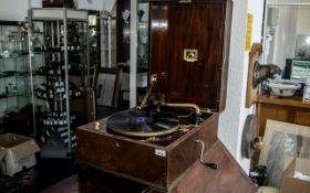 A Mahogany Cased Portable Wind Up Gramophone with HMV label to interior, in working order.