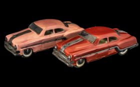 Two Minister Tinplate Saloon Cars in red and pink livery, unboxed, Regd.No.