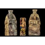 Three Chinese Soapstone Figures of Seated Deities, one decorated in coloured enamels; 7 inches (17.