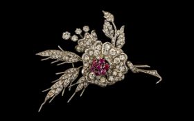 An Early to Mid Century Sterling Silver Brooch of floral design set with diamantes, approx 3" x 2".