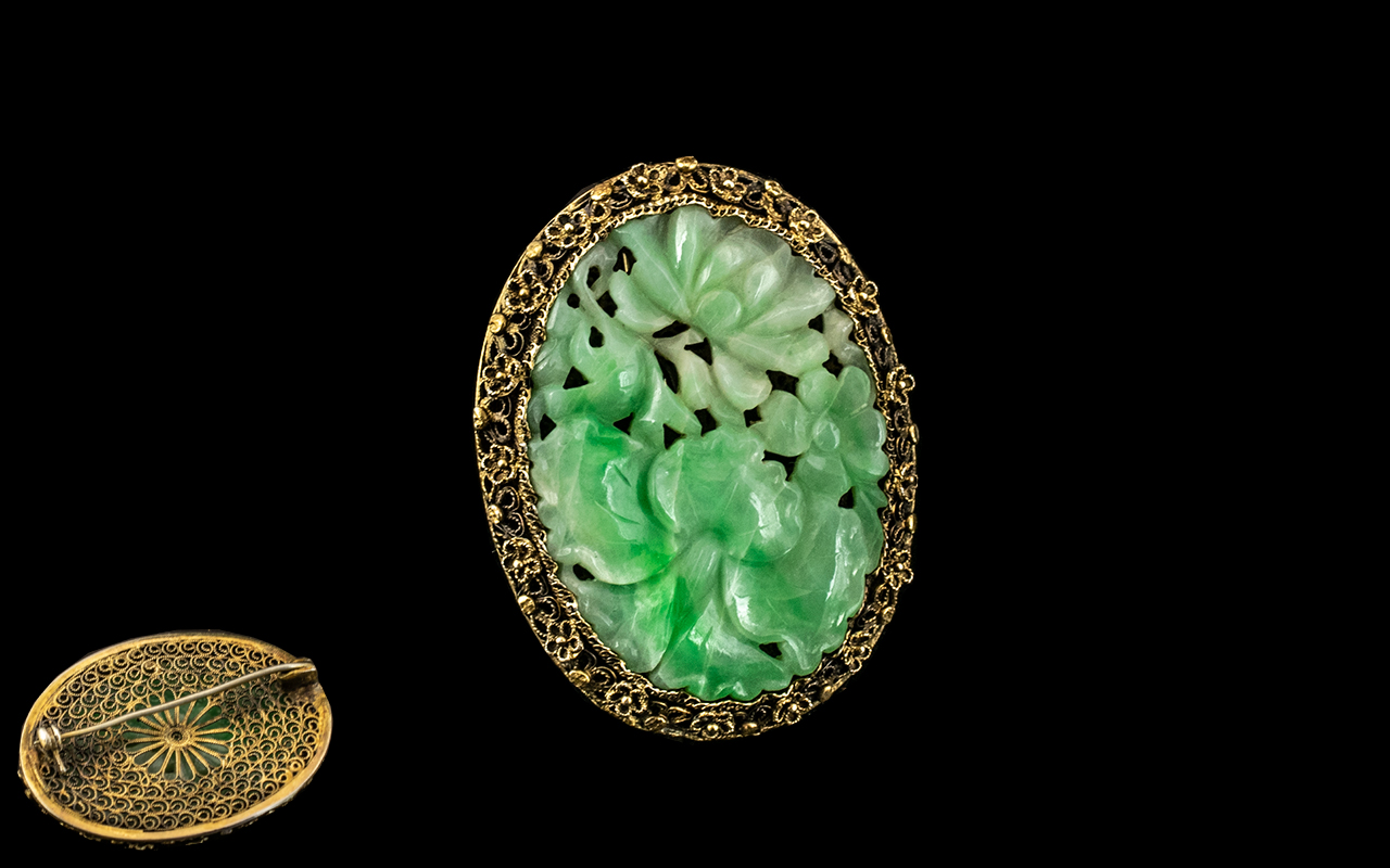 Antique Chinese Green Jade Brooch in a fancy yellow surround,