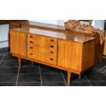Teak Designer 1960's Sideboard fitted to the centre with a bank of four drawers,