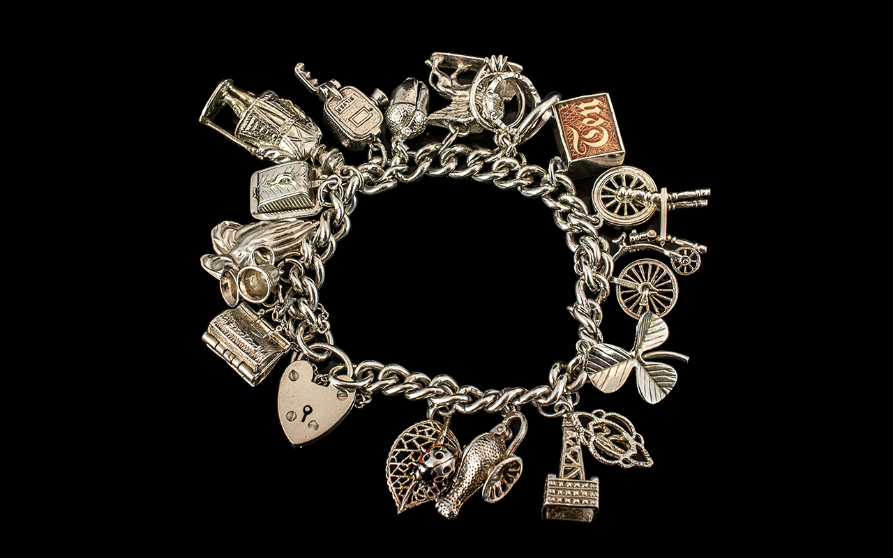 A Vintage - Good Quality Sterling Silver Charm Bracelet Loaded with 17 Sterling Silver Charms, - Bild 2 aus 2