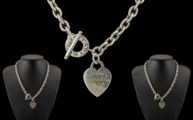 Tiffany & Co Sterling Silver Necklace with Attached Heart Shaped Tag, Which Reads Tiffany & Co,