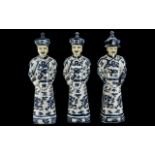 Set of Three Chinese Blue and White Porcelain Figures of Mandarins, 20thC,