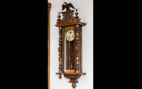 Late 19th Century Spring Driven Vienna Wall Clock, of typical form with eagle pediment.