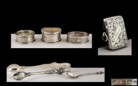 Small Selection of Silver Items comprising three napkin rings, Birmingham 1920s, silver vesta case,