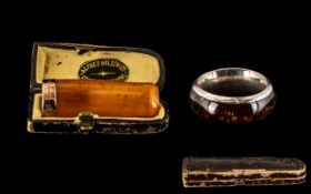 Amber and 9ct Gold Cheroot Holder in original leather box marked Alfred Wilson Ltd.