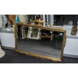 Decorative Over Mantle Mirror, bevelled glass with ornate gilt frame with finial and swags.