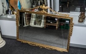 Decorative Over Mantle Mirror, bevelled glass with ornate gilt frame with finial and swags.