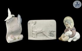 Two Lladro Plaques, one signed Lladro Collectors Society white plaque, and one glazed Lladro Society