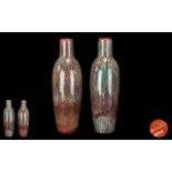 A Pair of Large Bretby Vases, with Ruskin type drip/mottle glazes in reds and pale greens.