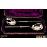 Victorian Period Pair of Sterling Silver Salad Servers with Black Ebony Handles.