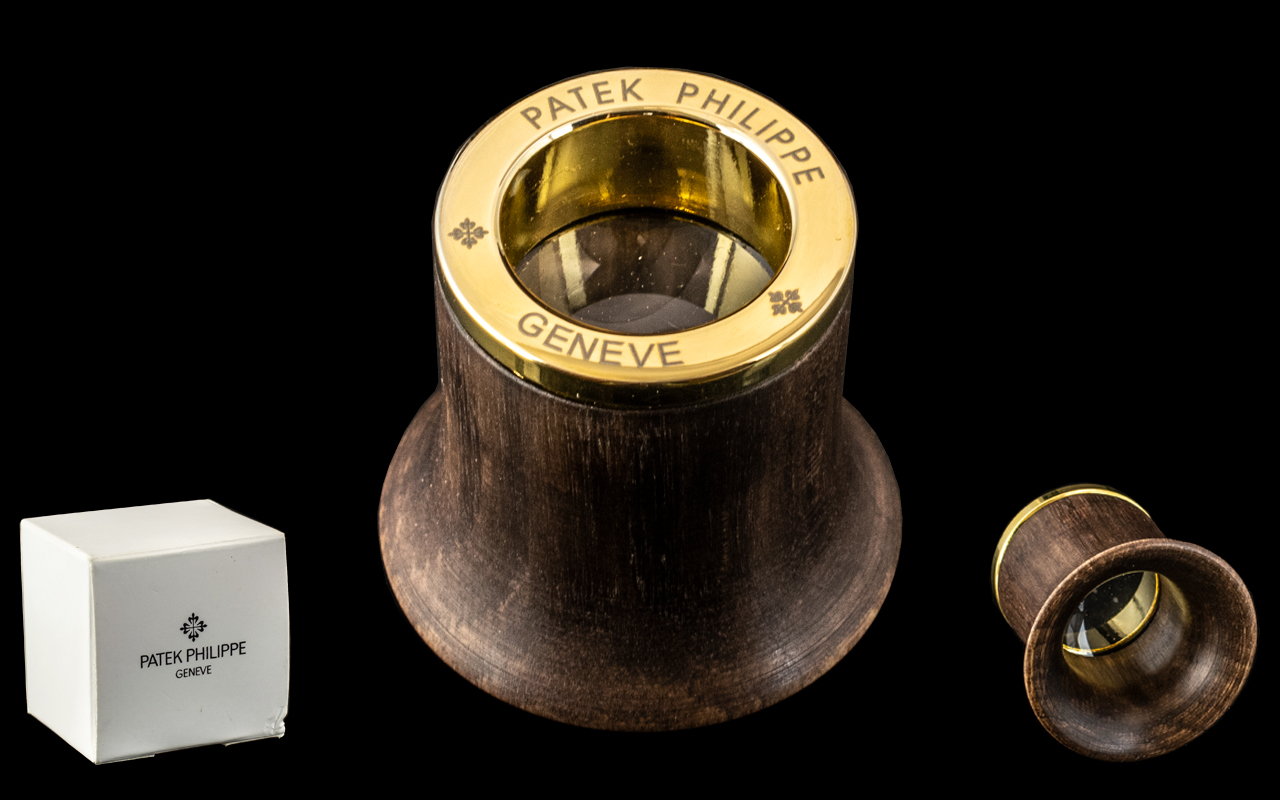 Patek Philippe Signed Jeweller's Loupe. Watch accessories, made from maple with gold coloured base.