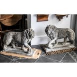 Pair of Reconstituted Medici Lions with their paws resting on a ball, weather-worn.
