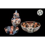 Small Imari Lidded Vase, 9 inches (22.5cms) high, with two small Imari bowls, 9 inches (22.