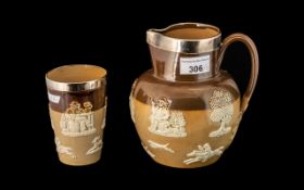 Doulton Lambeth Stoneware Ale Jug and Beaker, both with hallmarked silver rims,