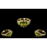 Peridot and Topaz Cluster Ring, five graduating, oval cut peridots, set across the finger,