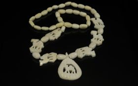 A 1930's Camel Bone Carved Necklace, probably North African, depicting carved camels.