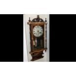 A Late Victorian Drop Dial Wall Clock, with marquetry inlay and carved case.