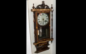 A Late Victorian Drop Dial Wall Clock, with marquetry inlay and carved case.