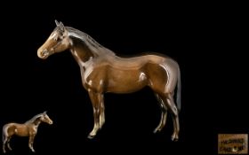 Beswick Small Standing Horse, in a glazed brown colour