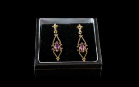 9ct Gold Amethyst Set Drop Earrings. Earrings of Good Quality and Design Throughout. 3 cm Drop.