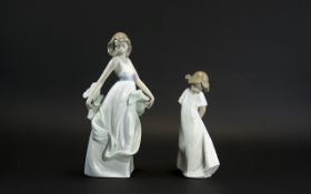 Two Nao Figures, comprising: a young lady with a shawl,