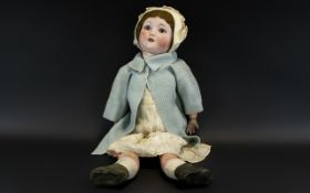 Schoenau and Hoffmeister Bisque Head Doll with jointed body of large size,