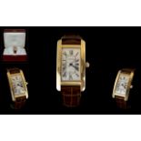 Cartier - Tank Americaine 18ct Gold Automatic Wrist Watch.
