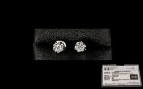 Platinum Diamond Stud Earrings set with a central round, modern brilliant cut diamond surrounded