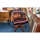 Burgundy Leather Captain's Desk Chair with buttoned back and seat, with swivel action,