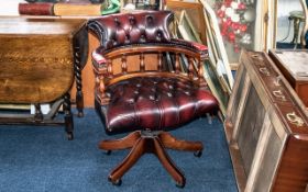 Burgundy Leather Captain's Desk Chair with buttoned back and seat, with swivel action,