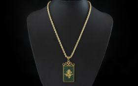 A Hong Kong Jade Pendant in base metal suspended with a 14ct Gold Hollow Rope Chain 16 inches in