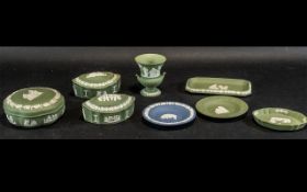 Small Collection of Wedgwood Jasper Ware comprising three green lidded boxes,