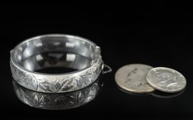 Silver Hinged Bangle, engraved floral decoration to front, fully hallmarked 1966,