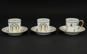 Antique Sevres Porcelain Set of Three 'Napoleon' Coffee Cans and Saucers with the symbolic N and