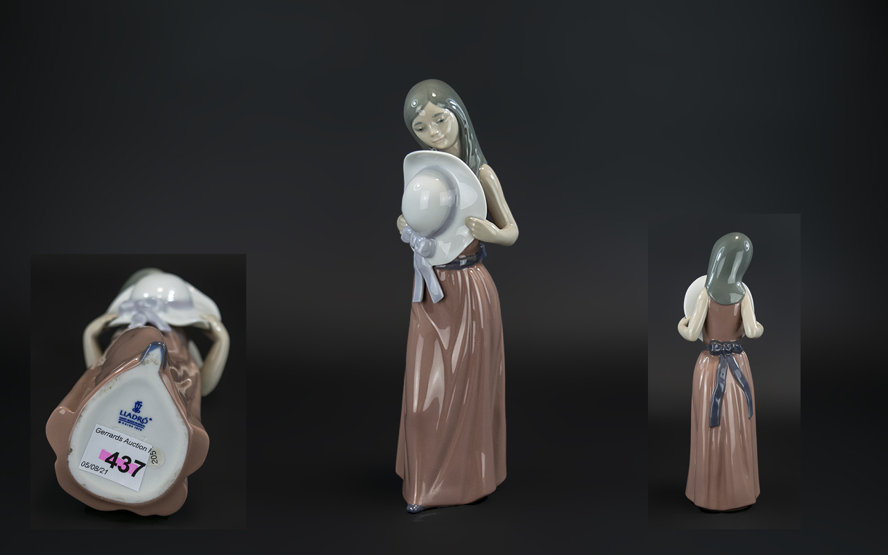 Lladro Hand Painted Porcelain Figure 'Bashful', model no.5007, issued 1978 - 1997, 9.25 inches (23.