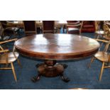 A Large George III Mahogany Tilt Top Loo Table, raised on a pedestal. Lacking connecting bolts.