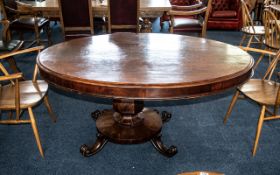 A Large George III Mahogany Tilt Top Loo Table, raised on a pedestal. Lacking connecting bolts.