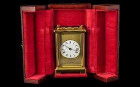 Modern Brass Cased Carriage Clock of Fine Quality With Carrying Handle by H.Samuel, With a Round