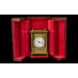 Modern Brass Cased Carriage Clock of Fine Quality With Carrying Handle by H.Samuel, With a Round