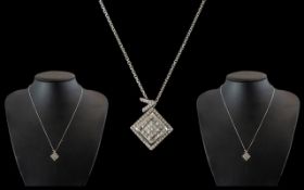 18ct Gold Diamond Set Pendant of square design set with princess cut diamonds.