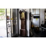 A Late Georgian Mahogany Cased Grandfather Clock, with an arched brass 8-day movement dial,