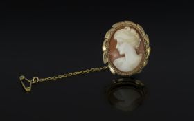 Antique Period 9ct Gold Ornately Mounted Shell Cameo of oval form, with safety chain,