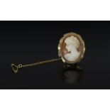 Antique Period 9ct Gold Ornately Mounted Shell Cameo of oval form, with safety chain,