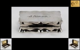 A Silver Snuff Box of shaped rectangular form hallmarked for Birmingham V 1945 2.5 by 1.5 inches.