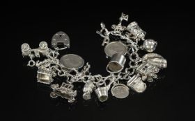 Excellent Quality Vintage Sterling Silver Charm Bracelet - Loaded with 17 Sterling Silver Charms.