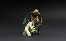 Austrian Style Cold Painted Bronze Group of a Nubian with a Slave Girl, unsigned, 7 inches (17.